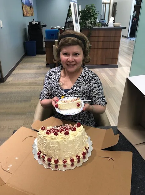 Fabiola Soderquist holding a decorated cake
