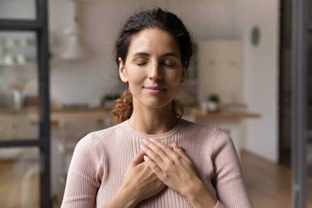 A female patient meditating.